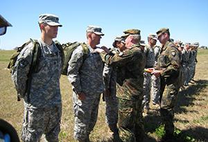 ROTC Students recieving German Proficiency Badge from their officers